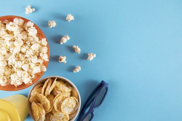 Popcorn Bowl and bowl of chips on Blue Background