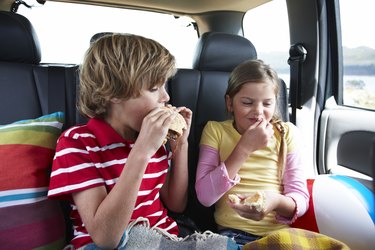Kids eating fast food on a road trip