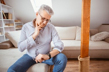 a man checking his pulse at the carotid artery in his neck