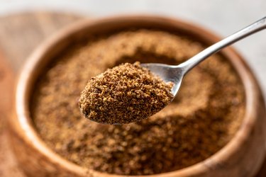 Ground flax seeds in a wooden bowl