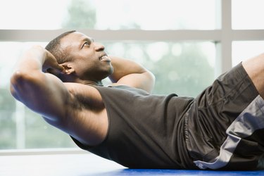 Stomach Protrusions With Sit-Ups: Causes, Treatments and Prevention