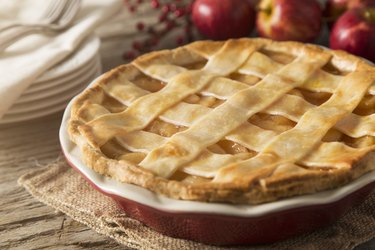 Baked frozen apple pie in a pie dish on tabletop