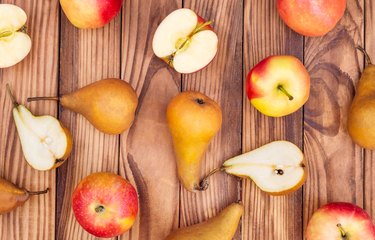 fructose-rich Apples with pears on the wooden background. Top view.