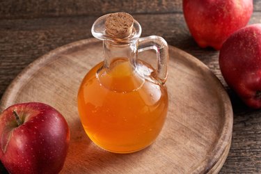 Apple cider vinegar in a bottle on a table