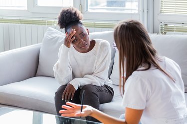 Patient on couch talking with a mental health professional