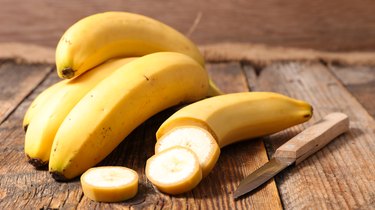 banana, a food you can eat to raise your potassium quickly,  on wood background