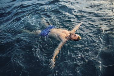 Young man floating in water