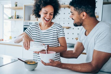 Couple having breakfast at home.