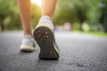 Close up of a person's shoes while walking, to represent aging feet changes