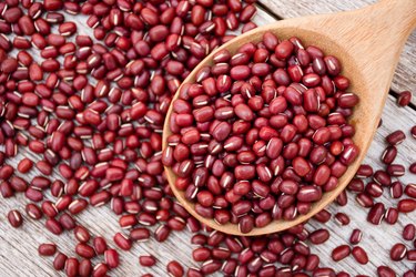 Antioxidant-rich small red beans on table with spoon