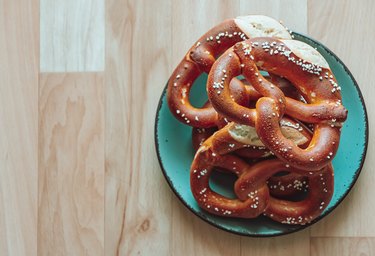Top view of pretzels on a plate with copy space