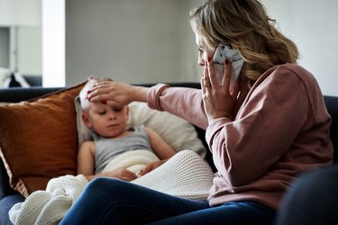 A sick child and his mother, who's using watchful waiting as a natural remedy for earache