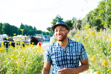 Happy man with allergies walking outside in spring