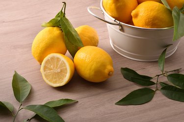 Lemons basket on wooden kitchen bench elevated