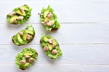 Tuna sandwiches with avocado and lettuce leaves
