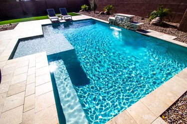 Back Yard With Two Lounge Chairs And Swimming Pool without herpes carriers