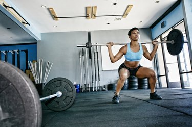 Black woman working out in gym