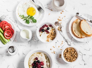 Breakfast - cottage cheese, yogurt, berries, oatmeal, fried egg, vegetables