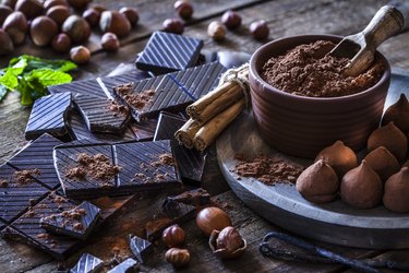 histamine-rich chocolate truffles and bars on wooden table