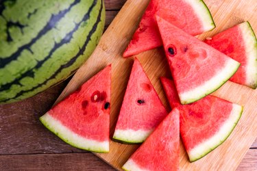 Fresh ripe watermelon, a great way to increase potassium quickly, slices on wooden table.