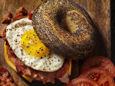 Poppyseed Bagel Sandwich with A Fried Egg, Bacon and Cheese