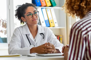 Patient speaking with doctor in a doctors office