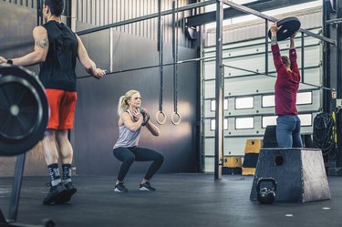 men and women exercising in a functional fitness studio