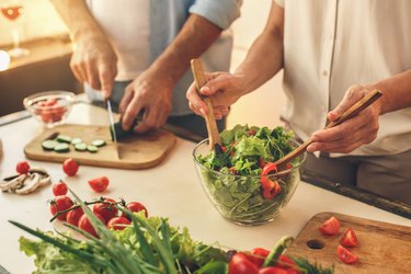 Senior couple cooking together at home love