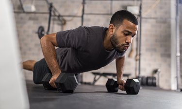 Man Doing Push-Ups With Dumbbells