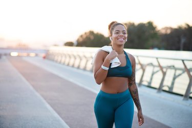 woman running outside in the morning, as a natural remedy for insomnia