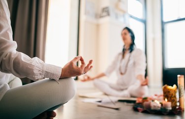 group of people meditating visualising during yoga session