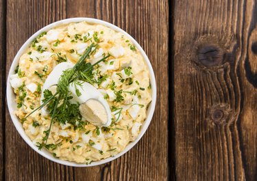 Bowl with Egg Salad on a Wooden Table