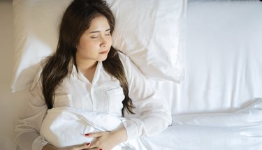 Young woman sleeping in bed