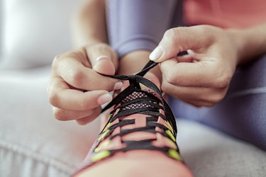 close view of a person tying their shoes