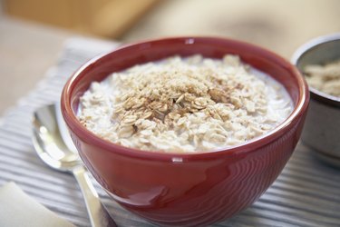 Oatmeal in red bowl with spoon for a candida diet