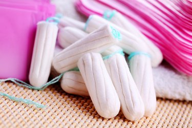 close view of a bunch of tampons on a bathroom surface