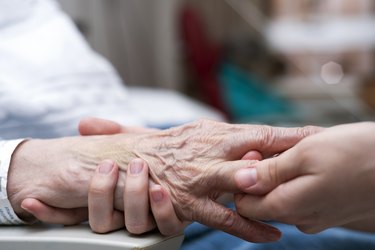 Senior woman receiving hand massage