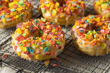 Homemade Gourmet Donuts with colorful fruity Cereal on Top