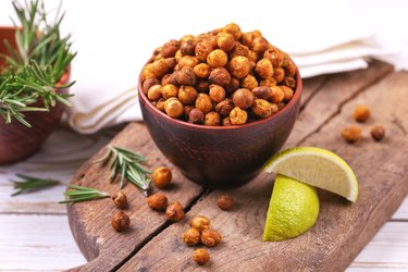 Roasted chickpeas in bowl with lime and rosemary