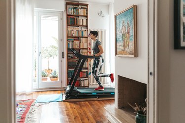 woman running on treadmill at home
