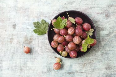 Bowl of red gooseberries