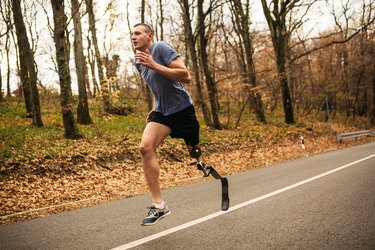 Person with prosthetic leg running outdoors as an example of muscular endurance and why it's important