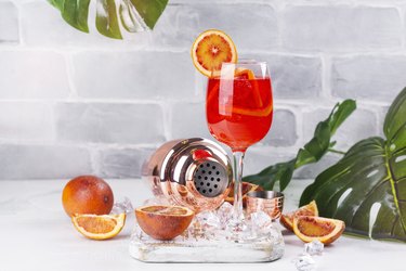 Summer sangria cocktail histamine-rich alcohol on table with orange slices