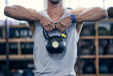 sloseup shot of a man doing a kb upright row