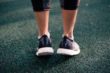 close up of a caucasian woman wearing ankle support shoes for walking