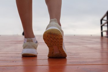 closeup of female wearing walking shoes taking steps