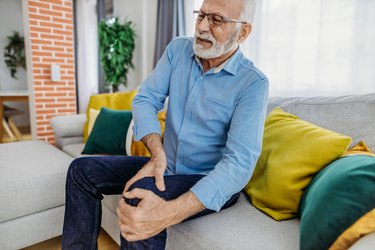 older adult at home with knee pain