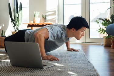 Person doing a push-up at home in living room