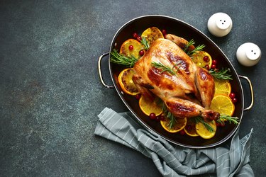 Roasted thanksgiving turkey stuffed with citrust fruits like oranges ,rosemary and cranberries