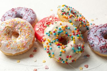 Tasty doughnuts on white background, close up